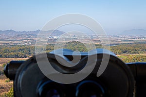 A view into North Korea across the DMZ from South Korea, from behind binoculars