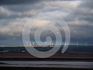 View from Northam Burrows to Fullabrook wind farm, North Devon, England on a stormy day.