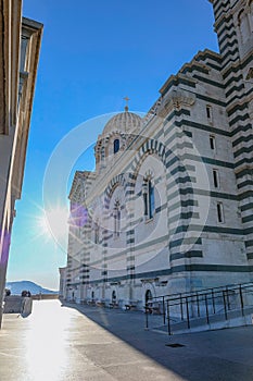 View of Notre Dame de la Garde on top of hill in Marseille. Basilica of Our Lady of Guard with morning rays of sun