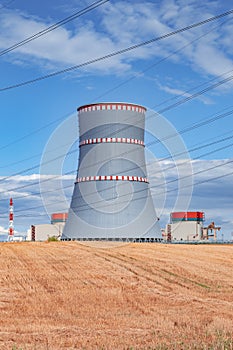 View of nuclear power plant, cooling tower and wires of high voltage line in Ostrovets, Belarus