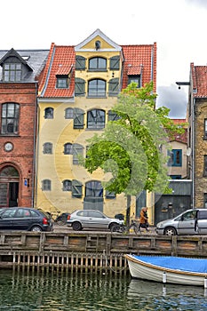 View of Nyhavn pier with color buildings, ships, yachts and other boats in the Old Town of Copenhagen, Denmark