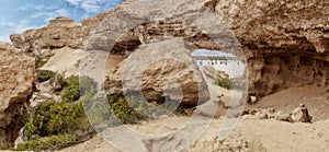 View of the oasis of the Namibe Desert, through the arch. Angola. Africa