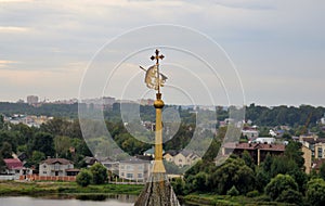 View from observation deck of belfry of Transfiguration Spaso-Preobrazhensky Monastery on spire with coat of Holy Gates, city an
