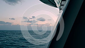 View of the ocean from a ship. Ocean at sunset.Waves behind the stern of the ship.