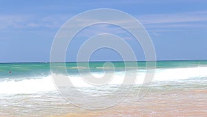 The view of the ocean waves on Hikkaduwa beach, Sri Lanka.