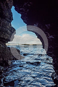 View on a ocean waves from a small grotto by Rosses beach county Sligo, Ireland