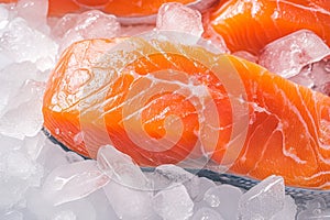 view Oceanic freshness Close up of raw salmon fillets on a bed of ice photo