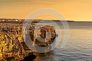 view of the oceanside cliffs of Puos Point on the western coast of Menorca Island photo
