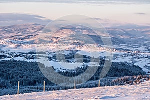 View from Ochodzita hill above Koniakow village in Silesian Beskids mountains in Poland during freezing winter morning