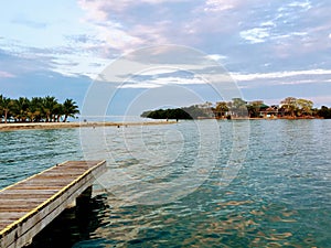 A view off the docks of the sandy tip of Placencia, Belize photo