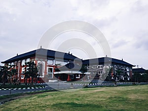 View Of Office Building In The City With A Large Parking Lot