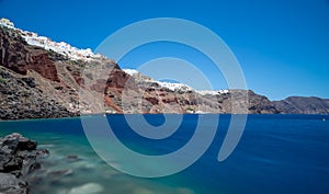 View of Oia, the famous white village above the cliff