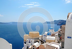 The famous blue domed Anastasis Church in Oia, Santorini, Greece photo