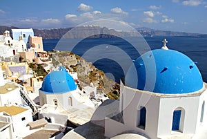 The famous blue domed Anastasis Church in Oia, Santorini, Greece photo