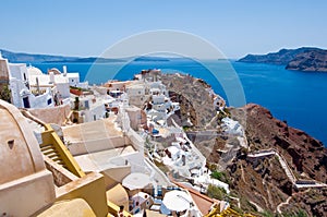 View of Oia town and the castle of Oia towards Thirassia, Thera (Santorini),Greece. photo