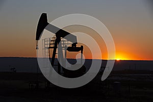 View of Oil Well Pumpjack at Sunset Oil Industry