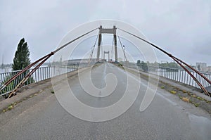 View of old abandoned cable-stayed Rybalskii bridge, Kyiv,Podol, Ukraine