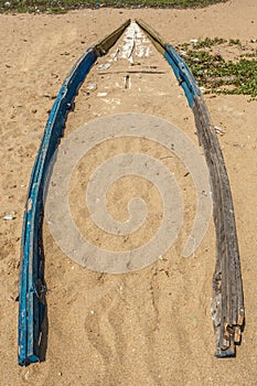 View of an old or abandoned fishing boat buried in beach sand, Kailashgiri, Visakhapatnam, Andhra Pradesh, March 05 2017