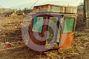 View of an old abandoned trailer in the countryside. An image of decrepitude or natural disaster