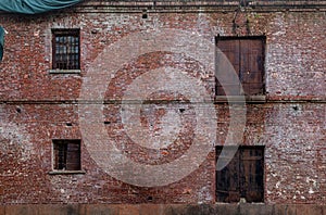 View of old abandoned two storey jail wall