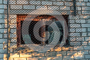 view of an old barn in sunset light, old windows in an ancient building, summer