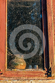 view of an old barn in sunset light, old windows in an ancient building, summer