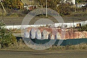 View of an old base of combustible lubricants. Barrels for storing gasoline. An old settlement.