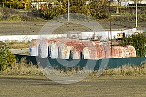 View of an old base of combustible lubricants. Barrels for storing gasoline. An old settlement.