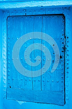view of an old blue door in the blue city of Chefchaouen, Morocco
