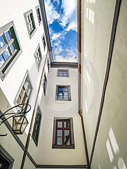 View of an old building in city centre with sky and clouds