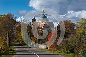 View of the old catholic church of the Holy Trinity and the road, Benitsa, Belarus