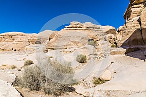 A view of old cave dwellings beside the path leading to the ancient city of Petra, Jordan