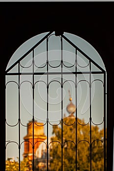 View of old church through window with bars