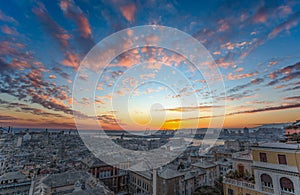 View of old city and the port at sunset, Genoa, Italy.