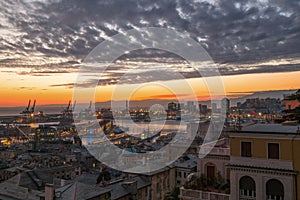View of old city and the port at sunset, Genoa, Italy.