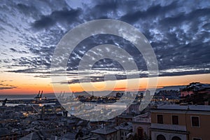 View of old city and the port at sunset, Genoa, Italy.