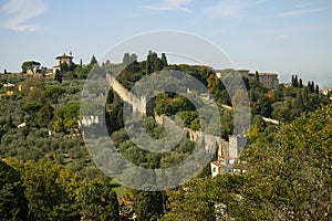 View on old city wall in Florence - Firenze. Landscape with green trees