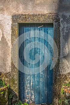 View of an old closed door in rustic wood painted blue