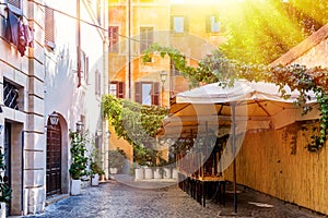 View of old cozy street in Rome, Italy. Old Trastevere district in Rome, Italy during summer sunny day