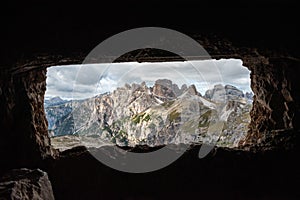 View through an old embrasure in an alpine fortress of the World War I, marking the former Austro-Italian frontier in the Dolomite