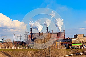 View of old factory with pipes with smoke. Air pollution, environmental damage