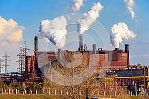 View of old factory with pipes with smoke. Air pollution, environmental damage