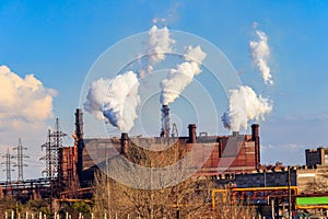 View of old factory with pipes with smoke. Air pollution, environmental damage