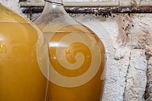 View of old fashioned wine cellar with glass storage for wine during fermentation process