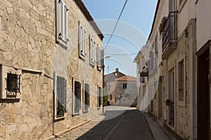 View of old, historical, traditional stone houses in famous, touristic Aegean town called Alacati.