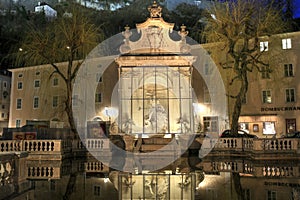 View of the old Horse Well at the Kapitelplatz Square at night. Salzburg, Lower Austria