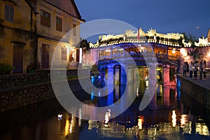 View of the old Japanese bridge in night illumination. Historical landmark of the city Hoi An, Vietnam