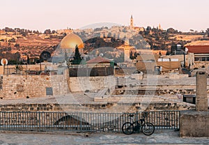 View of Old Jerusalem from the Mount. View of old city from the roof, with lattice and bicycle on foreground.