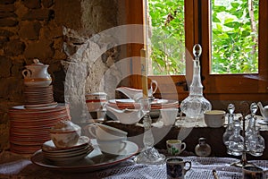 View of old kitchenware next to a window inside a Catalan farmhouse