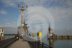 View of the old lighthouse and statue of Imperia in harbor of Konstanz on the lake Bodensee, Germany.